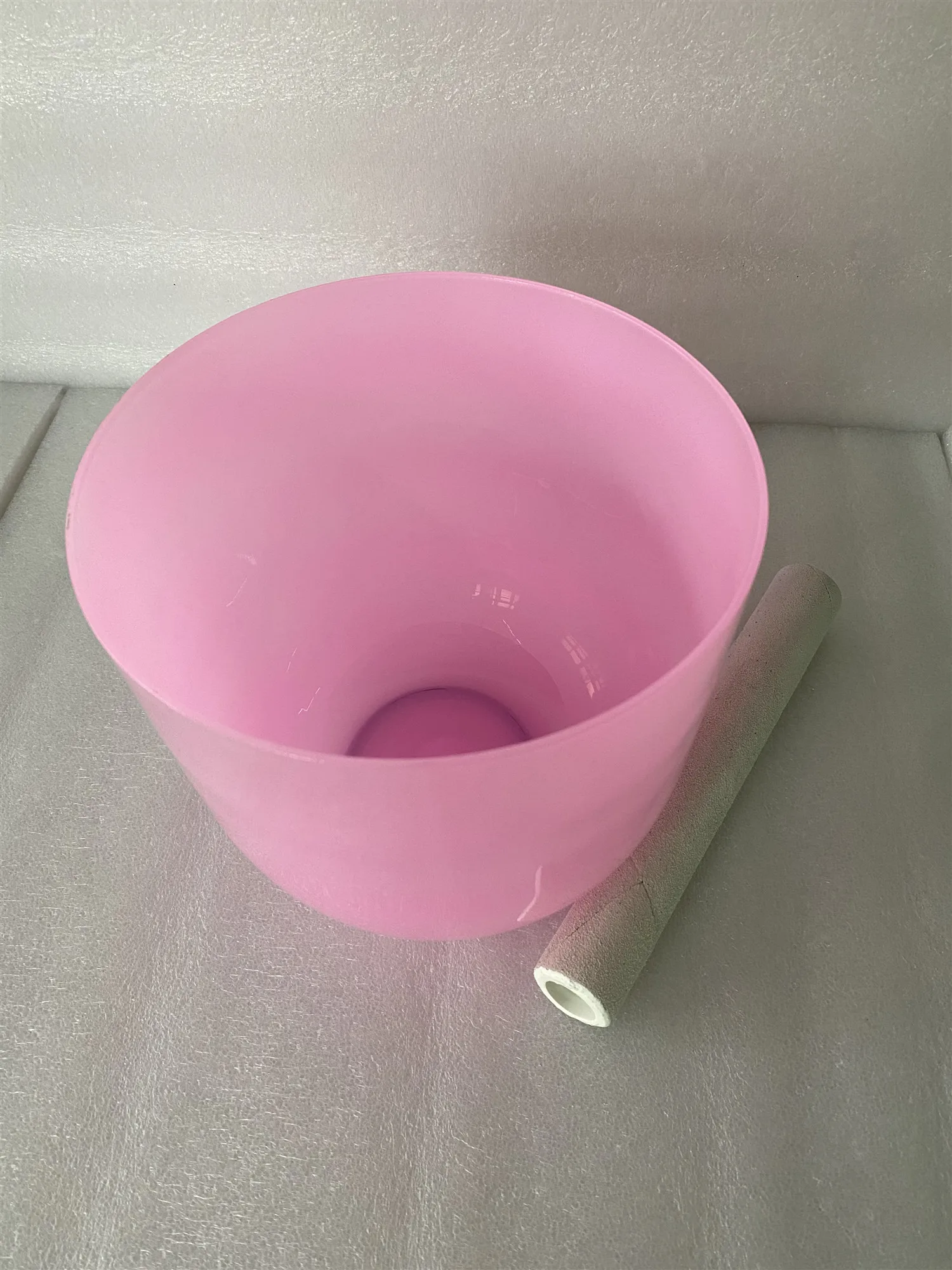 Crystal singing bowl pastel pink color 432Hz 3rd octave B note crown chakra for sound healing.