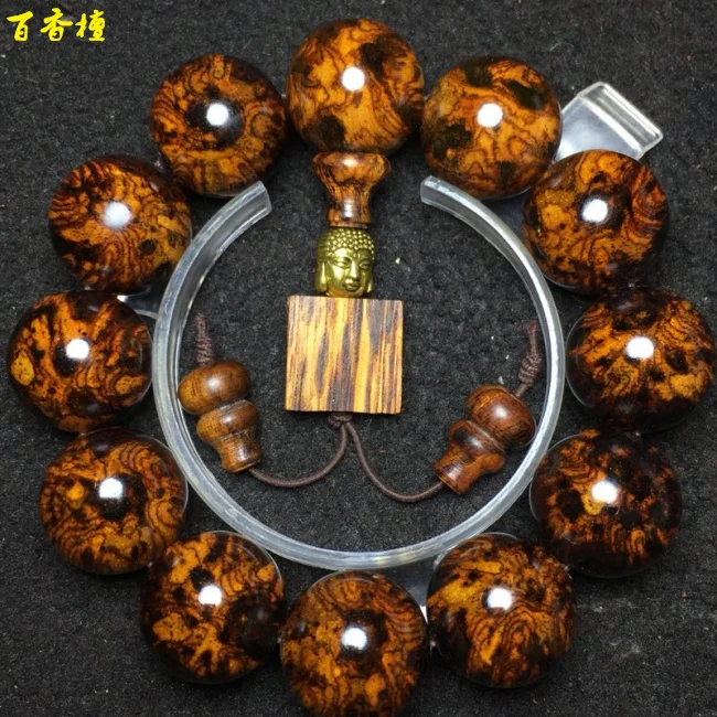 

Hainan Huanghua pear Buddha bead hand string 2.0 smoke pattern spider pattern Hainan Huanghua pear tumor scar tiger skin pattern