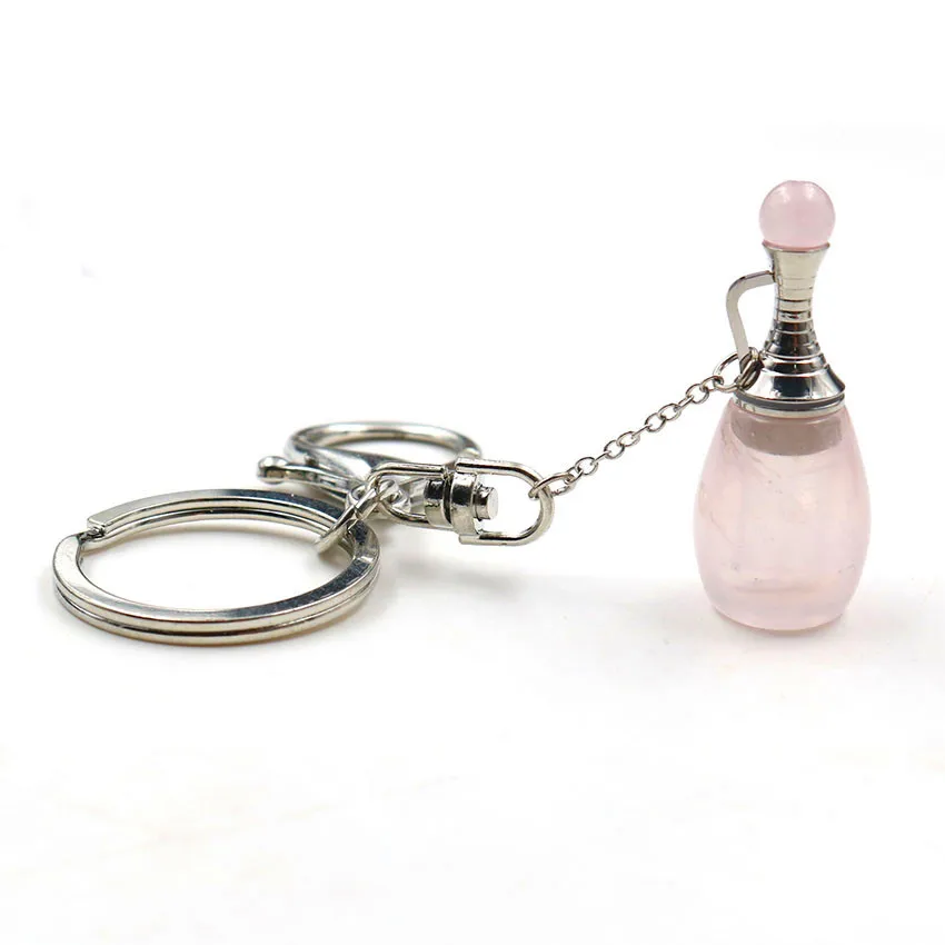 

FYJS Unique Silver Plated Circle Lobster Clasp Rose Pink Quartz Perfume Bottle Key Chain Rock Crystal Essential Oil Jewelry