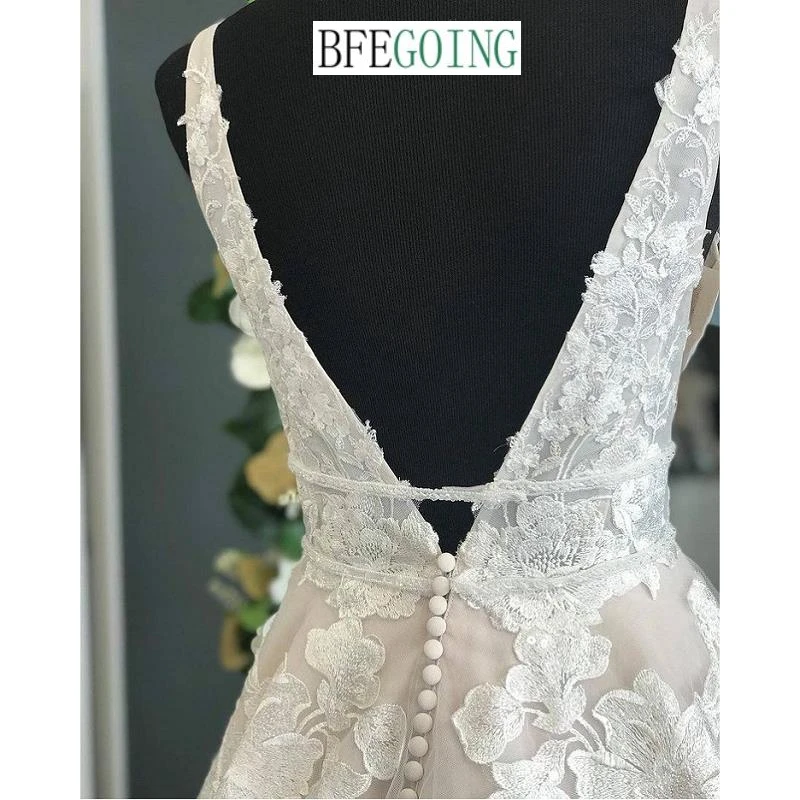 Rendas de luxo beading tule organza v-neck sem mangas a linha vestidos de casamento capela trem vestidos de noiva feitos sob encomenda