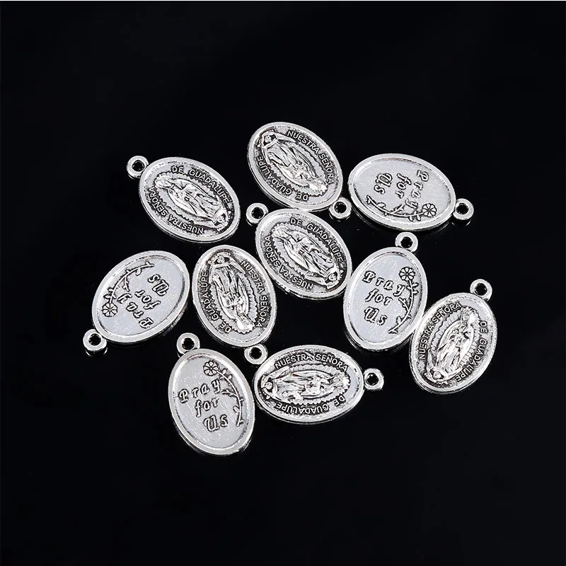A variety of religious Christ small pendants, Lourdes small pendants, Saint Francis small pendants, Saint Michael small pendants