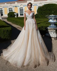 Trouwjurk O-Neck Wedding Dress Cap Sleeve Robe De Mariee Illusion Back Vintage Abiti Da Sposa Sequined Beading Bridal Gowns