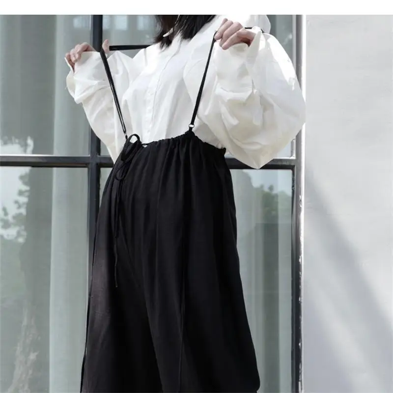 Spring and Autumn ladies loose suspenders jumpsuit nine division of trousers black suspenders fold vertical cotton linen