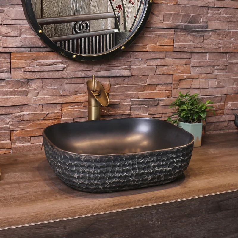 

China Artistic Handmade ancient Design Counter top black Ceramic wash basin oval