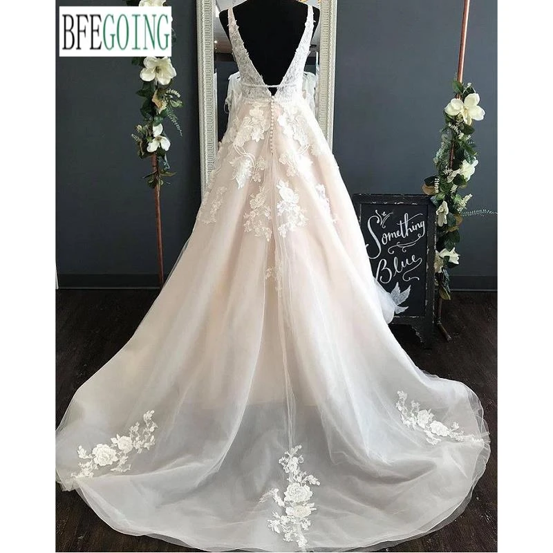 Rendas de luxo beading tule organza v-neck sem mangas a linha vestidos de casamento capela trem vestidos de noiva feitos sob encomenda