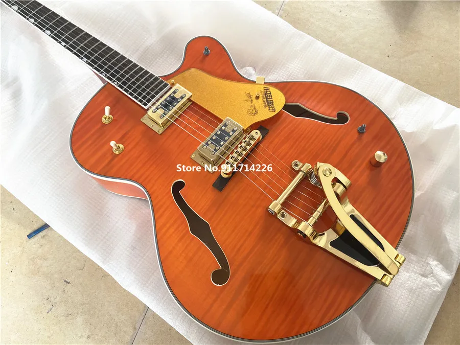 High quality custom version of jazz double F hole orange electric guitar gold large rocker vibrato