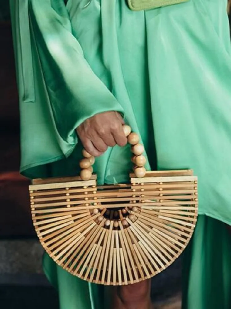 2021 New Wooden Bead Hand Woven Bag Outdoor Beach Clutch Rattan Bag Semi Circular Hollow Bamboo Bag