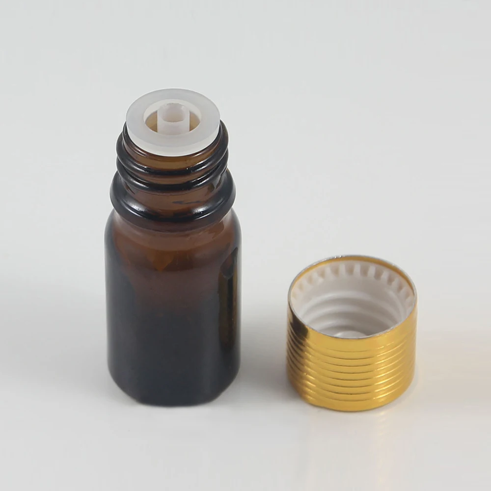 High quality 5ml skull shape glass dropper bottle for e-juice, amber glass bottle with gold lids