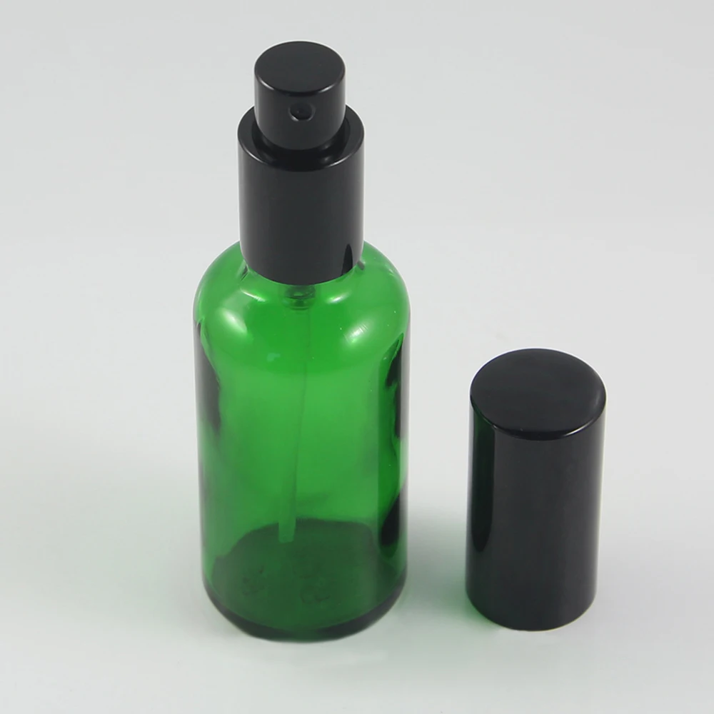 

Wholesale glass bottle 50ml green packaging with black aluminum mist spray bottle 1.7oz