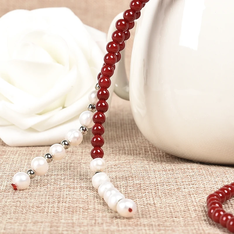 With a white pendant 2 rows PURE and Natural  pearls of red coral necklace.  Best for girl friend gift