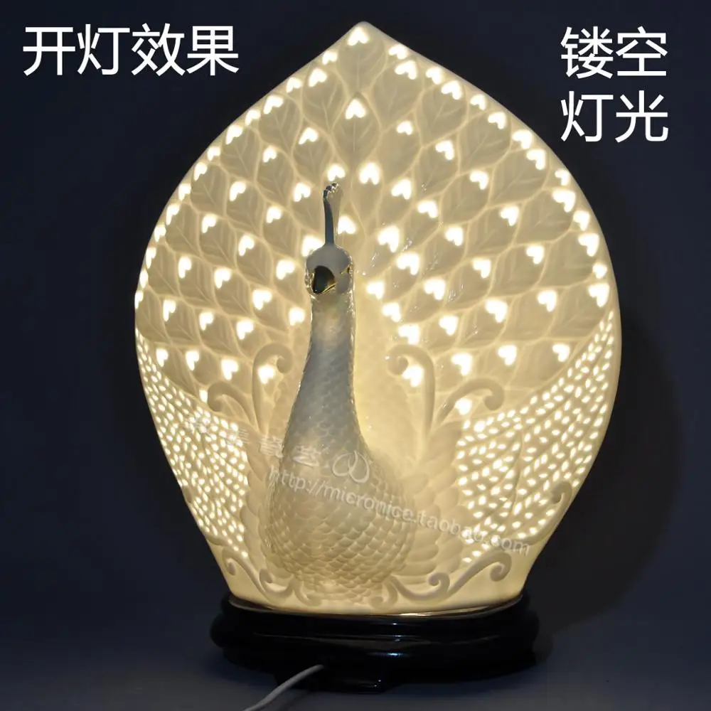 Peacock white porcelain lamp hollow lamp bedside lamp light in the bedroom modern pastoral real wedding wedding engagement