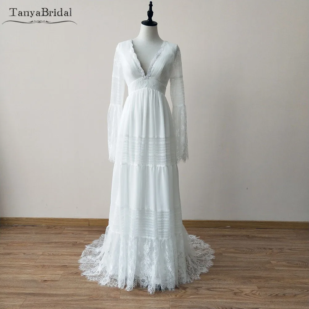 정교한 보헤미안 웨딩 드레스 긴 소매 레이스 비치 신부 가운 플레어 슬리브 백리스 베스 티드 드 Noiva 세련된 DW047