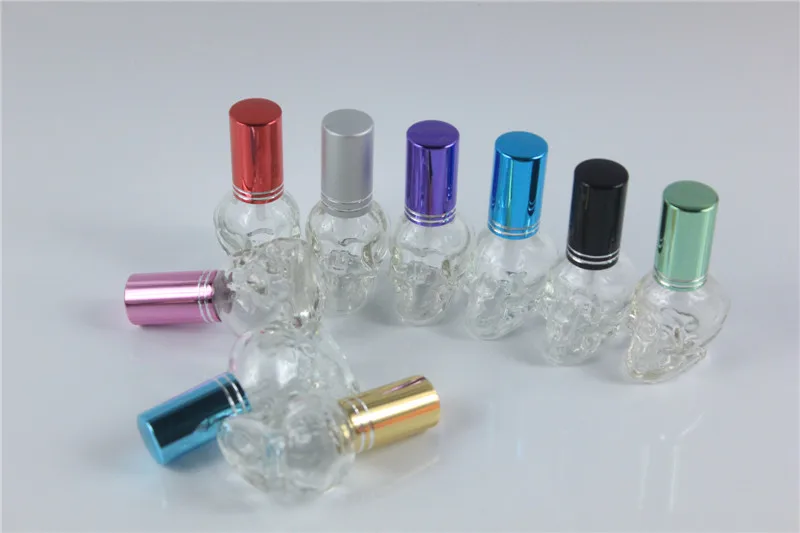 10 قطعة 8 مللي بوضوح الجمجمة شكل مصغرة صغيرة فارغة الزجاج عطر زجاجة عينة زجاجة مع الألومنيوم كاب رذاذ