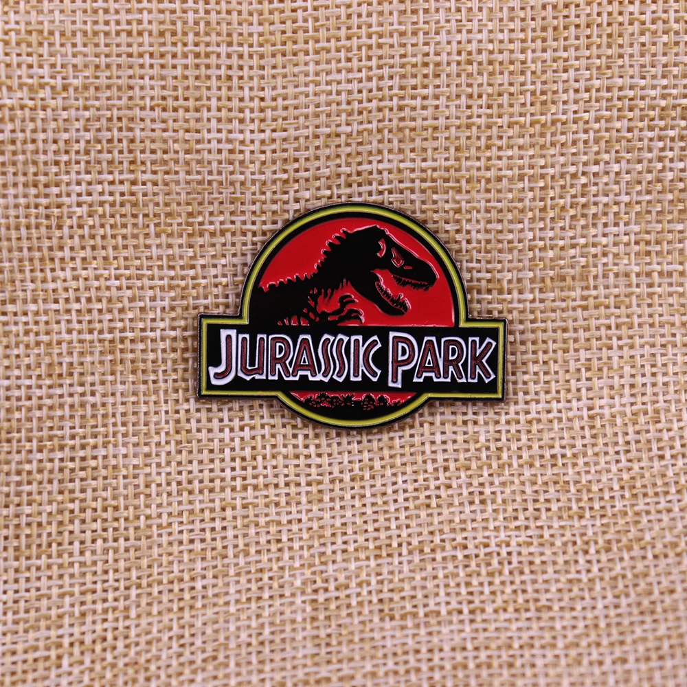Odznaka emaliowana dinozaura z parku jurajskiego