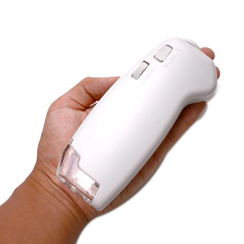 100X LED Enfoque iluminado Zoom ajustable Microscopio de bolsillo lupa de mano iluminada con escala de lectura 1DIV/0,02 MM
