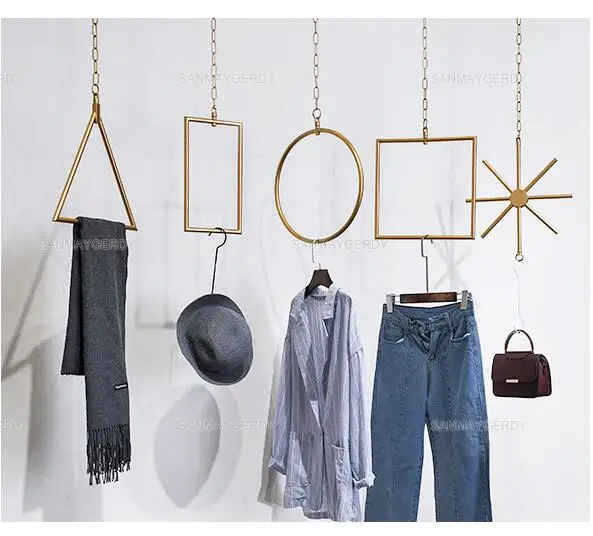 

Women's clothing store display rack The Wall rings iron decorative hanging shelves clothing store gold window wall hanging.