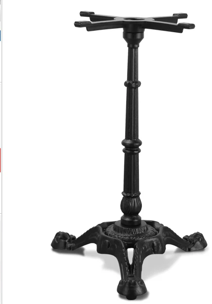 Western restaurant. The table legs. The legs. Support.. Wrought iron table leg.