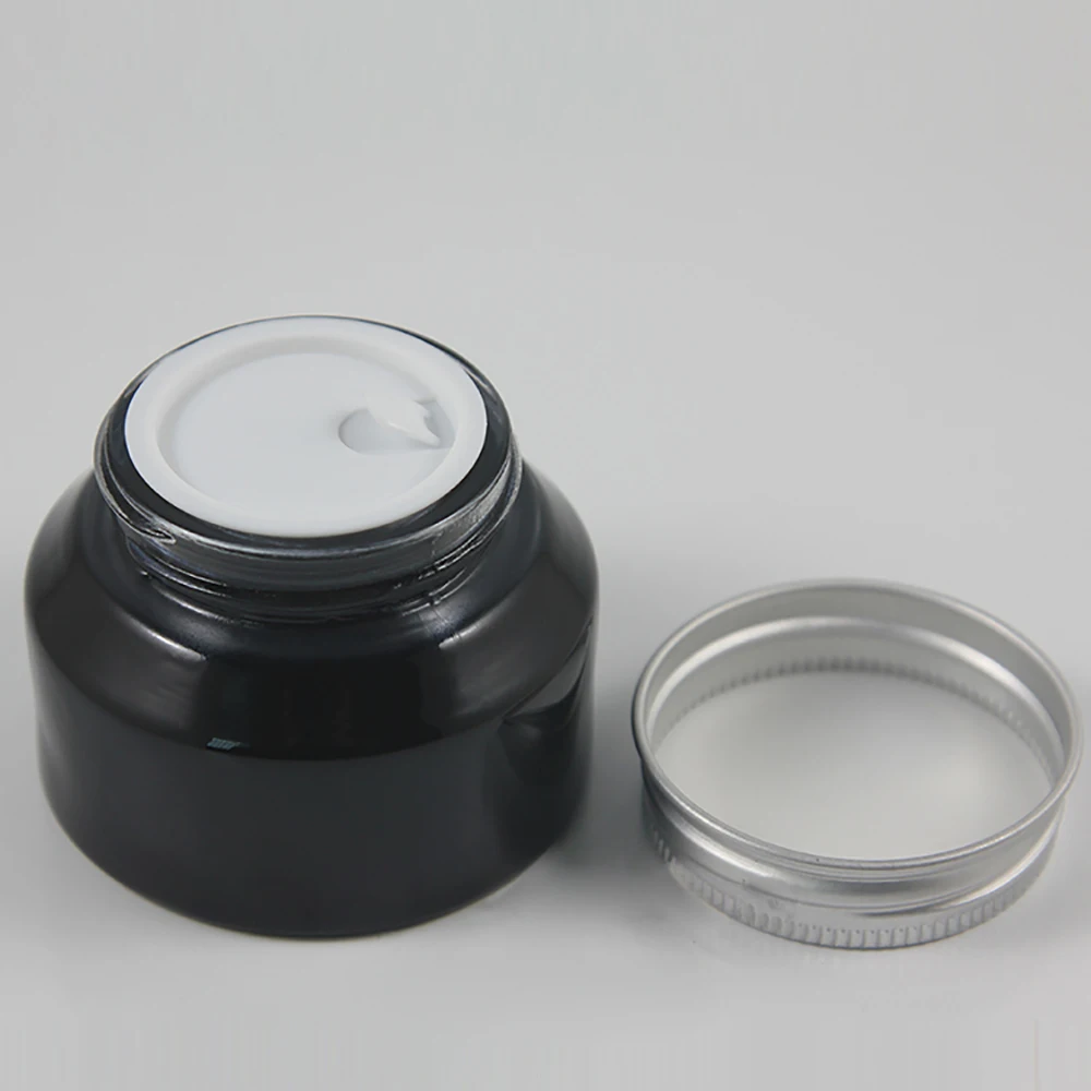 

50pieces High quality 50g shiny black cream jar with silver lid, empty glass cosmetic jar, black 50g glass eye cream jar