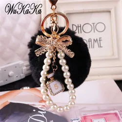 2026 Fashion Pearl Chain Crystal Bottle Bow Pompom Keychain Car Women handBag Key Chain Ring Fluffy Puff Ball Keychains Jewelry