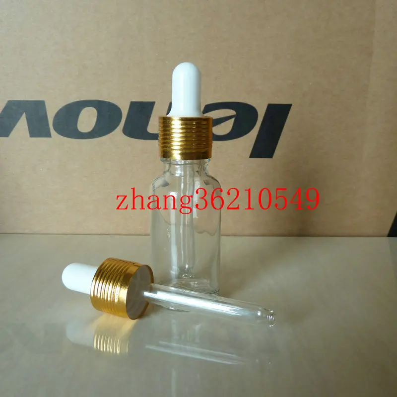 

20ml clear/transparent Glass Essential Oil Bottle With aluminum shiny gold dropper cap. Oil vial, Essential Oil Container