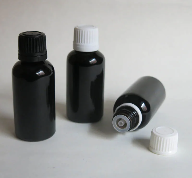 

wholesale 100pcs 30ML Black Glass Bottle, Juice Serum container ,30 ml glass Vials Essential Oil Bottle with white screw cap