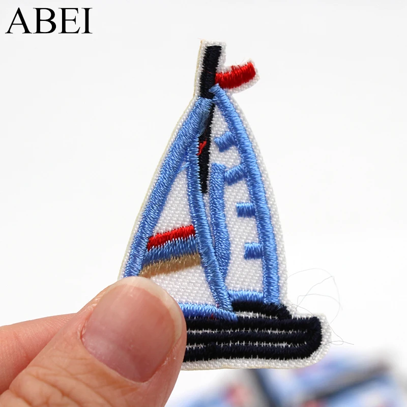 10pcs/lot Cartoon Blue Sailboat Patches Embroidered iron-on Appliqued Kids Apparel Bags Shoes Stickers DIY Patchwork Material