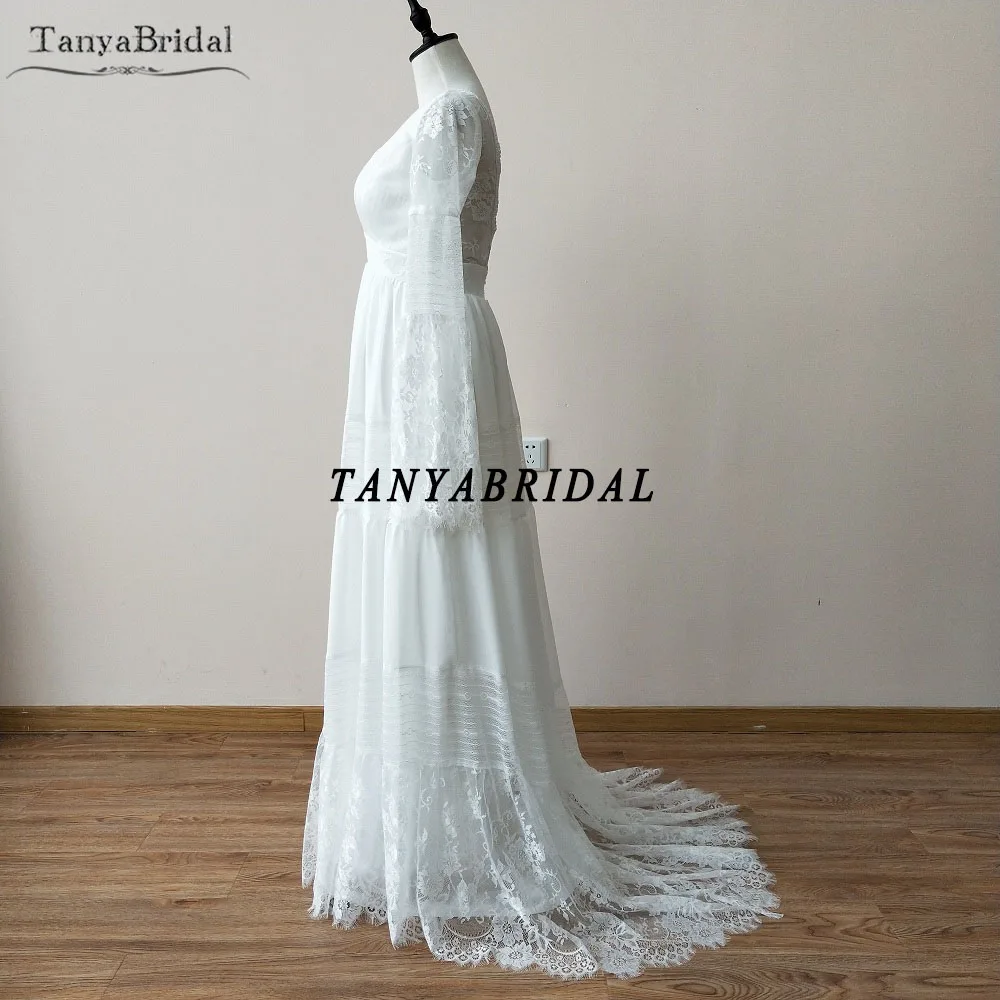 정교한 보헤미안 웨딩 드레스 긴 소매 레이스 비치 신부 가운 플레어 슬리브 백리스 베스 티드 드 Noiva 세련된 DW047