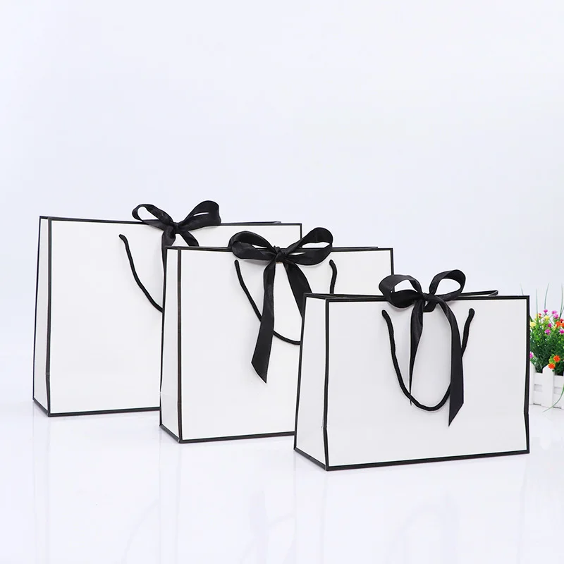 100pcs/lot Creative design Black border White kraft paper bag with handle Wedding Party Favor bowknot Paper Gift Bag Custom logo