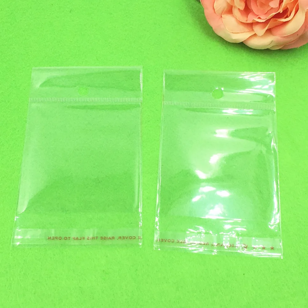 1000 pcs 12x6.5 cm Batal Transparan OPP Tas dengan Menggantung lubang Packing Plastik Tas Self Adhesive Seal tahan air OPP Tas