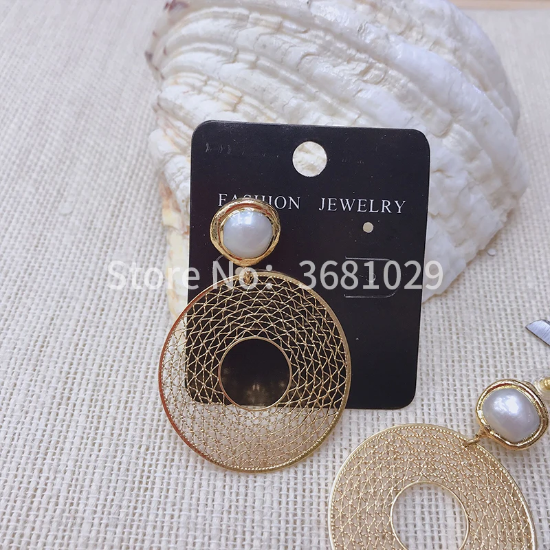 

Simple new summer vacation ring exaggerated pearl earrings personality matching earrings