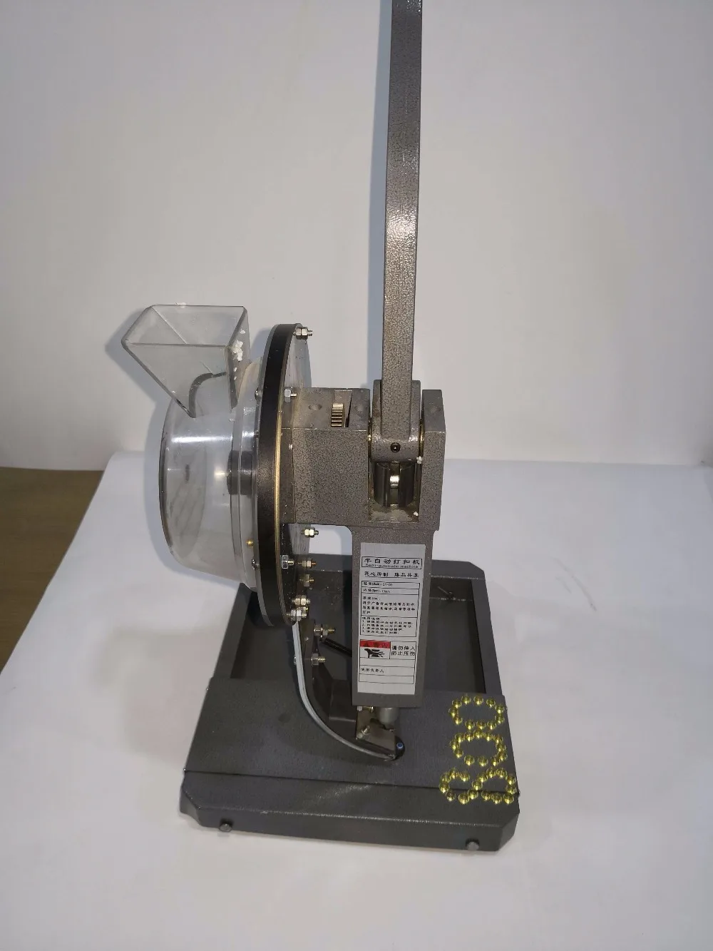 pressa per occhielli semiautomatica per materiali pubblicitari