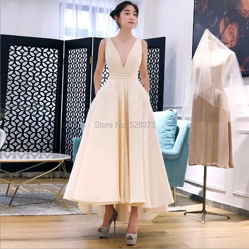 Chic Off - White Sleeveless Gown Deep V - neck high waist front - short - back - long Ideal for special events exudes elegaance