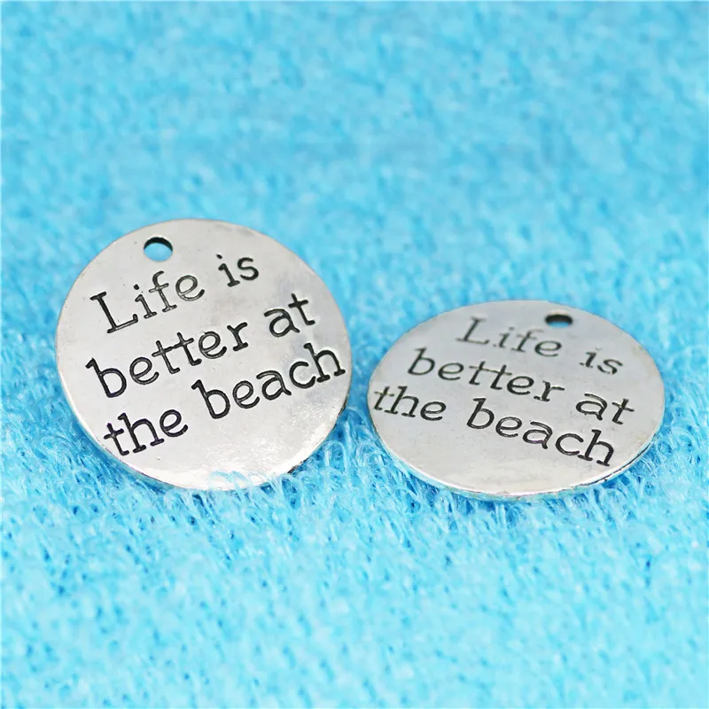 Top Quality 10 Pcs/lot Diameter 23mm Life is better at the beach Antique Silver plated Round Disc Quote Message Charms Pendant