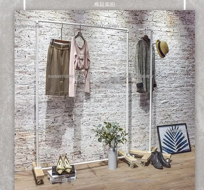 Clothing store display rack. Clothes rack women's shop floor-to-floor hangers. Solid wood Textile Gondola simple white gantry.