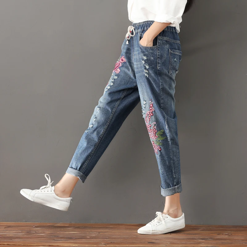 2018 spring and summer women's new Korean large size jeans elastic waist loose embroidery hole nine points harem pants TB181006