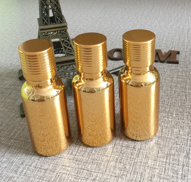 

hot sale 100pcs 20ml glass essential oil bottle with golden cap, wholesale high-grade 20 ml glass essential oil bottle storage