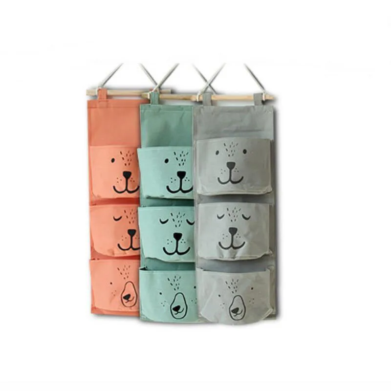 

New Cartoon expression Hanging bag Fabric Cotton Pocket Hanging Holder Storage Bag Rack makeup Cosmetic organizer storage basket