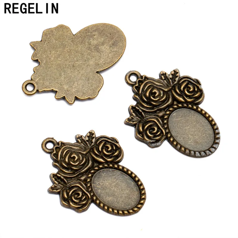 REGELIN wholesale oval rose Antique Bronze Pendant Trays 14*10 mm 20pcs/lot Bezel Pendant Settings for Glass or Stickers