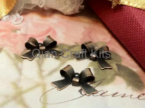 

500pcs antique bronze Metal Bow Connector Charm Drop 16mm