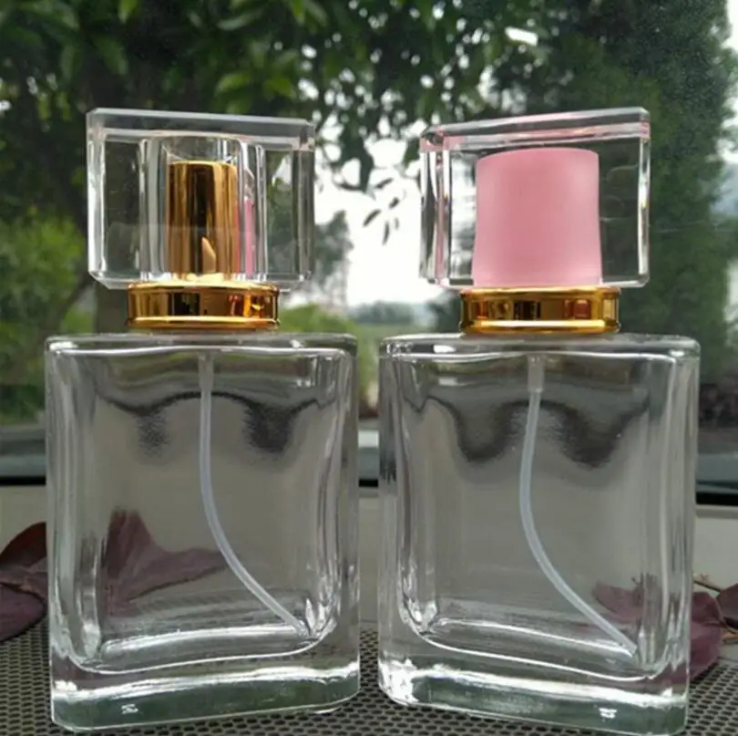 

Wholesale 50ML Square Transparent Glass Perfume Spray Cosmetics Empty Bottle with Acrylic Cap