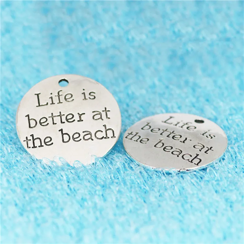 Top Quality 10 Pcs/lot Diameter 23mm Life is better at the beach Antique Silver plated Round Disc Quote Message Charms Pendant