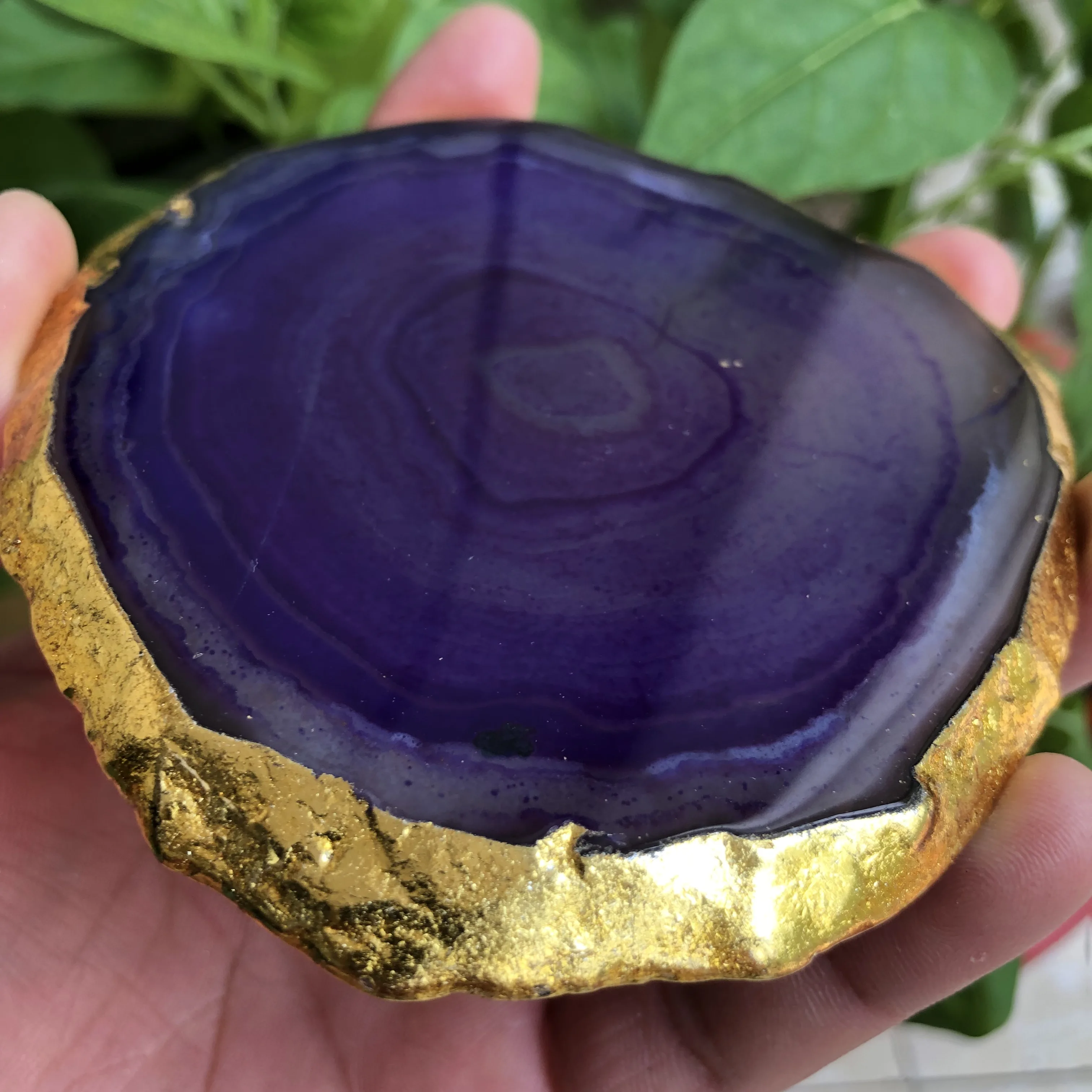 An isolated shore crystal plate, natural jacinth, with golden roller coasters -- bathed in the mineral lining of a bow tie