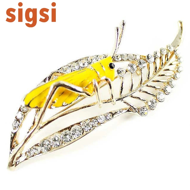 

1H x 3W inches News design grasshopper shape alloy leaf crystal brooch