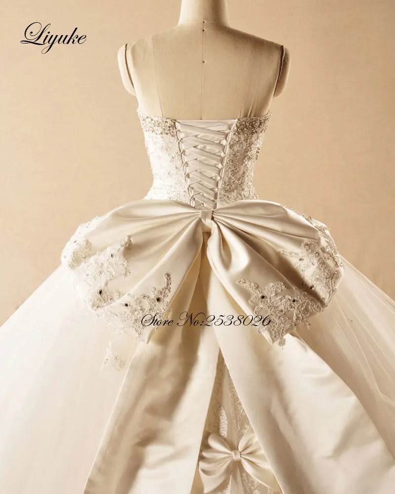 فستان زفاف Liyuke أنيق بدون حمالات مع فيونكة 2019 مزين بالخرز من الدانتيل فستان زفاف الأميرة رداء de mariage