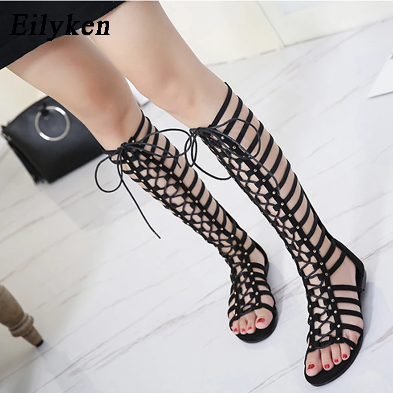 Eilyken Designer Women Sandals Strappy Open toe Knee High Summer Gladiator Flat Sandals Roman Bandage Casual Boots Shoes