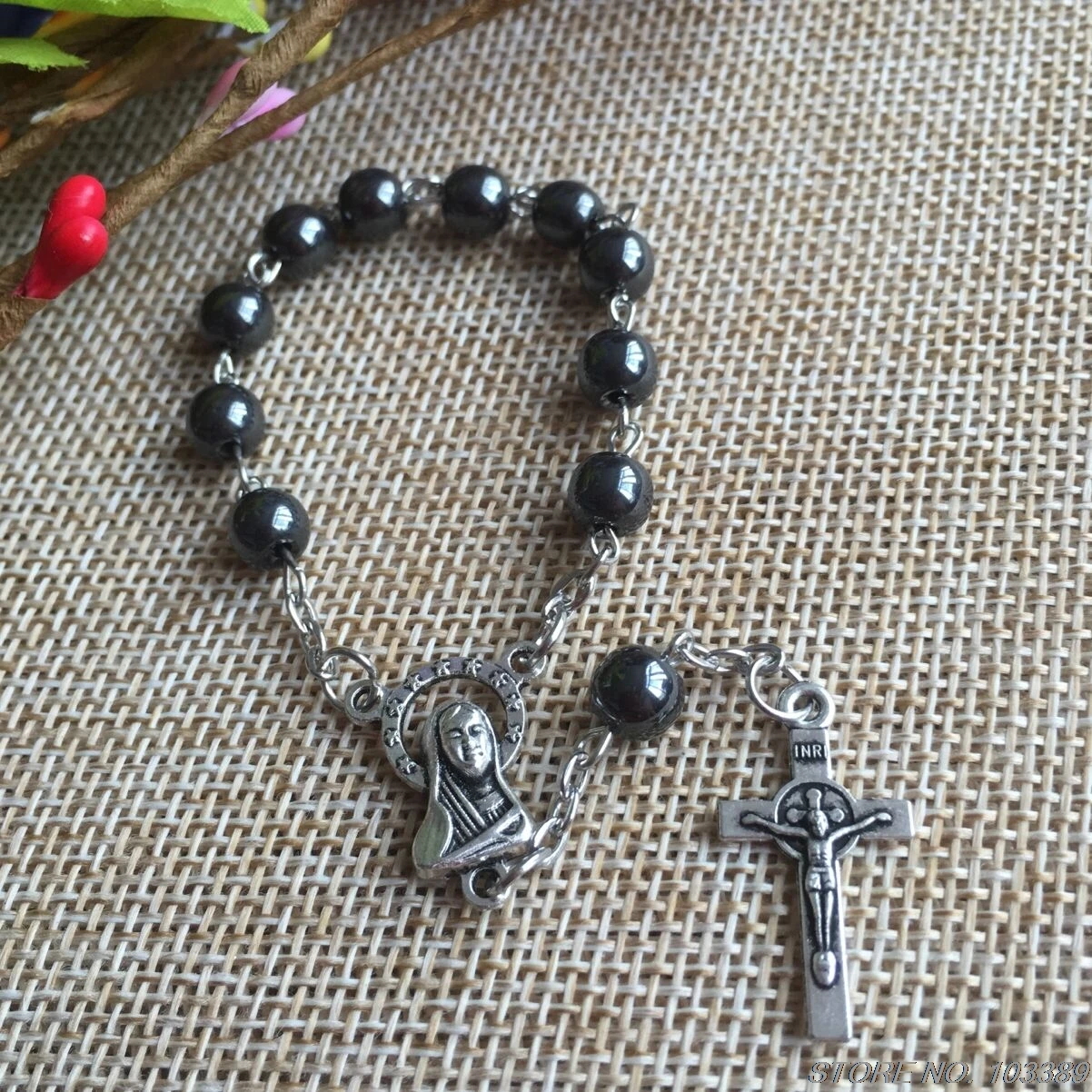 

black stone bracelet hematite beads benedict cross pendant