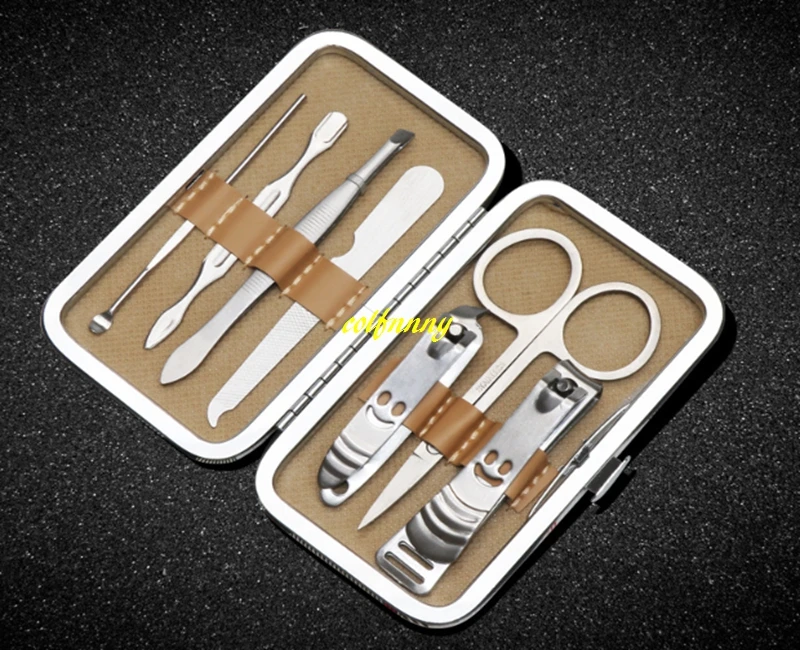 

50sets/lot Smile style 7pcs Manicure Set Stainless steel Pedicure Scissor Tweezer Knife Ear pick Nail Clipper Nail Care Tool