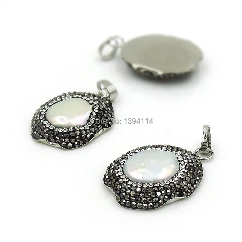 

Natural Pearl Oval Pendant With Copper Base And Side CZ-paved Platina Plated Approx 30*25mm
