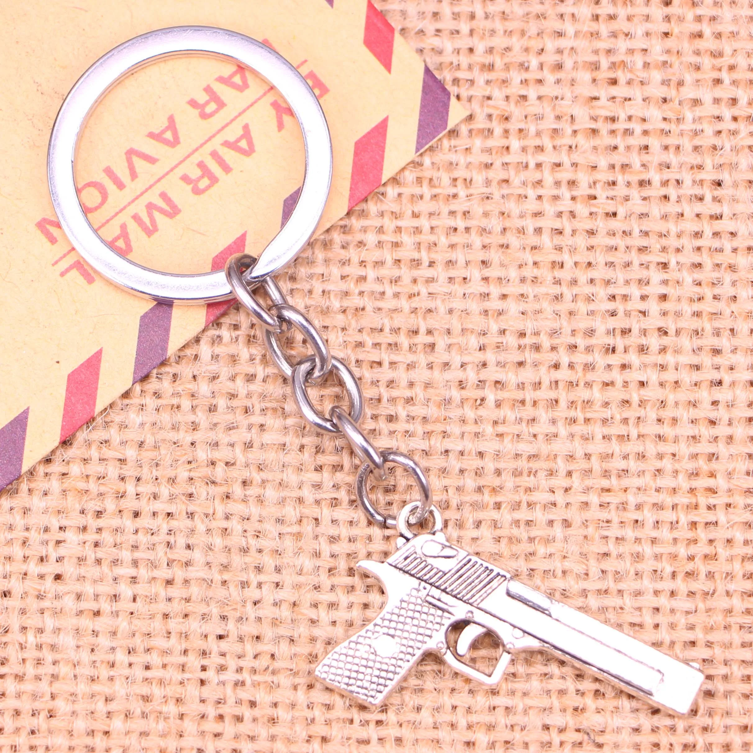 20pcs New Fashion Keychain 45*20 mm gun browning pistol Pendants DIY Men Jewelry Car Key Chain Ring Holder Souvenir For Gift