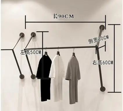 

clothing store display rack. Wall hangers. Hangers on the walls. Metal racks for men and women's fashion shops. Clothes rack.059